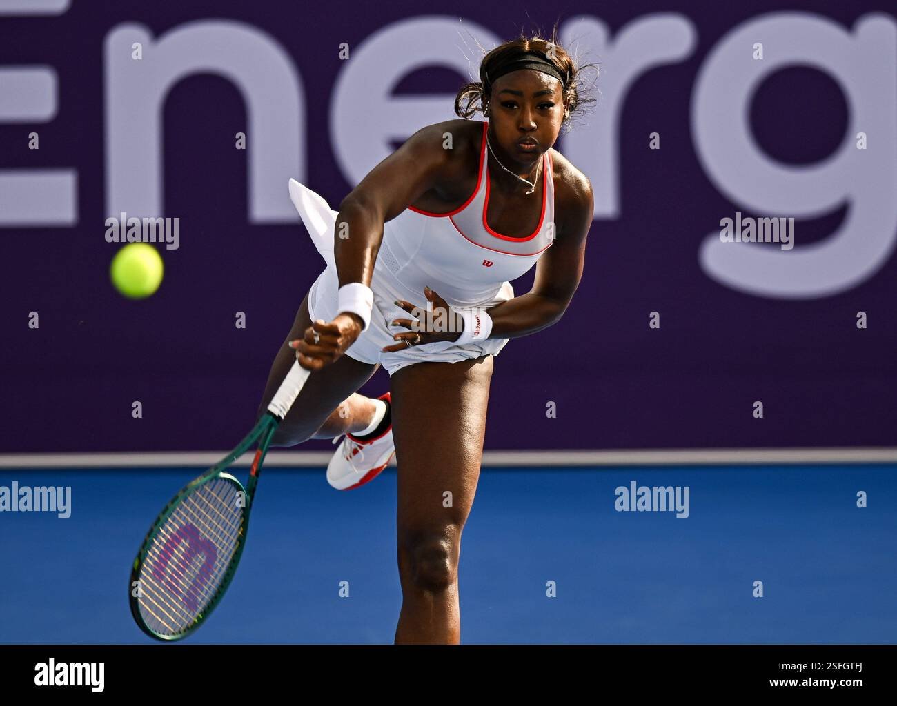 Alycia Parks performing a powerful tennis serve