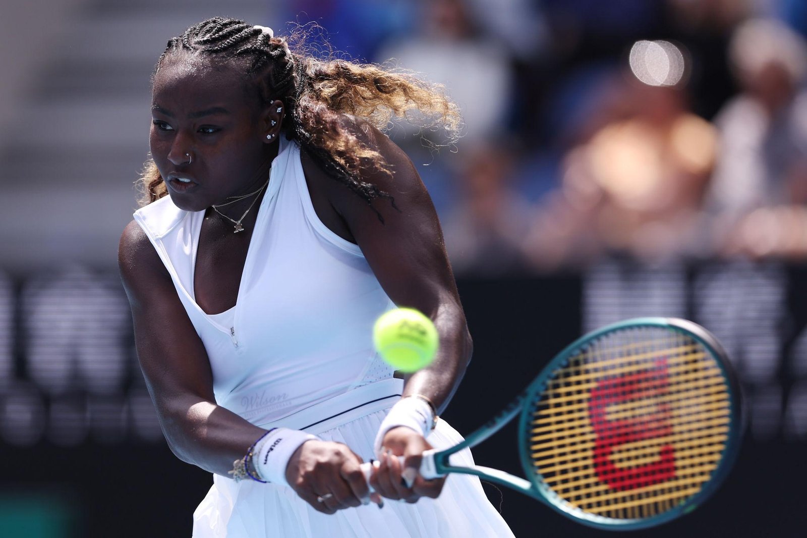 Alycia Parks performing a powerful tennis serve