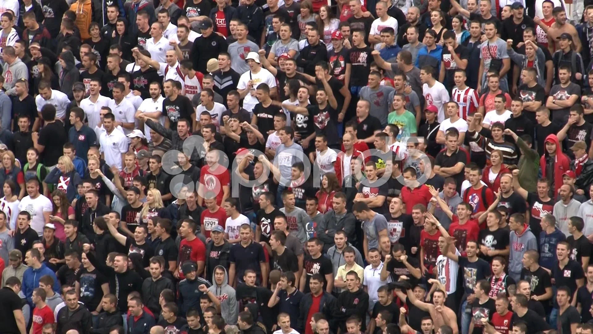 Passionate football fans cheering at a stadium in India