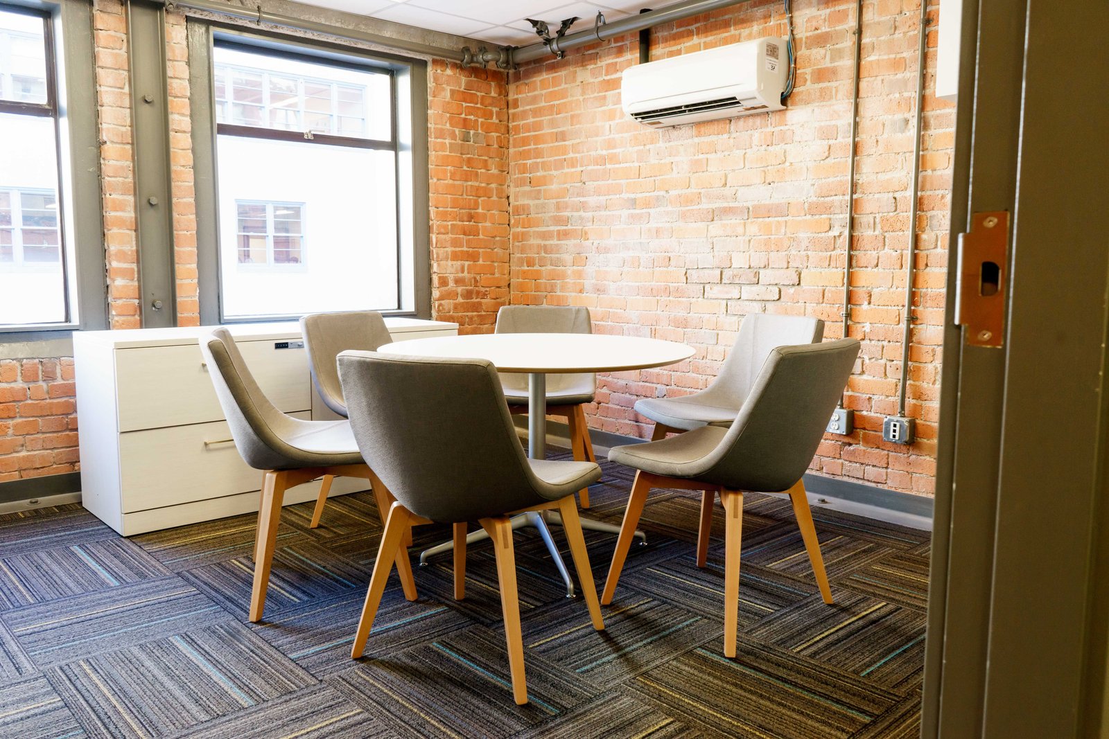 A group of professional teachers collaborating in a school staff room