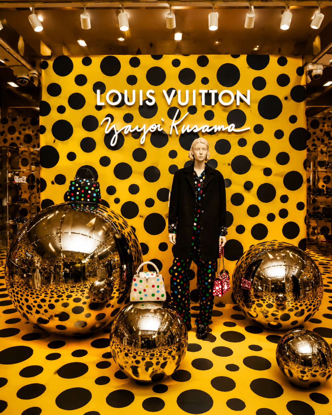 A luxury retail display featuring Yayoi Kusama's signature polka dots