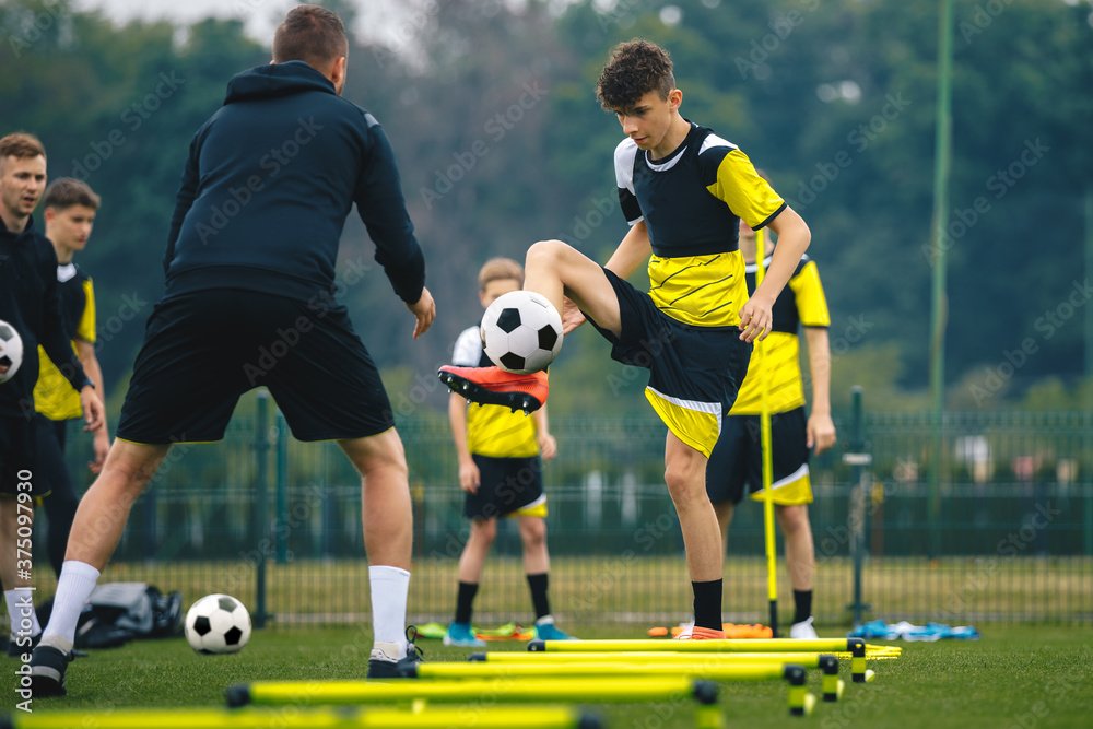 Athletes participating in a professional football training camp session