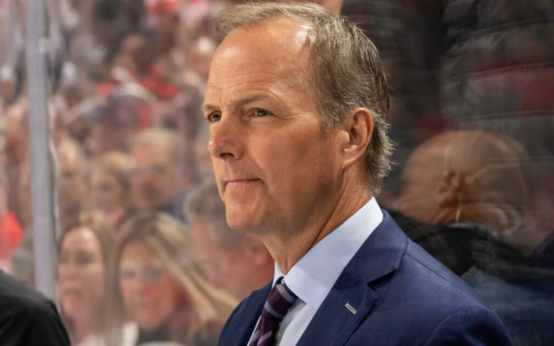 Coaches Jon Cooper and Martin St. Louis on the bench during an NHL game
