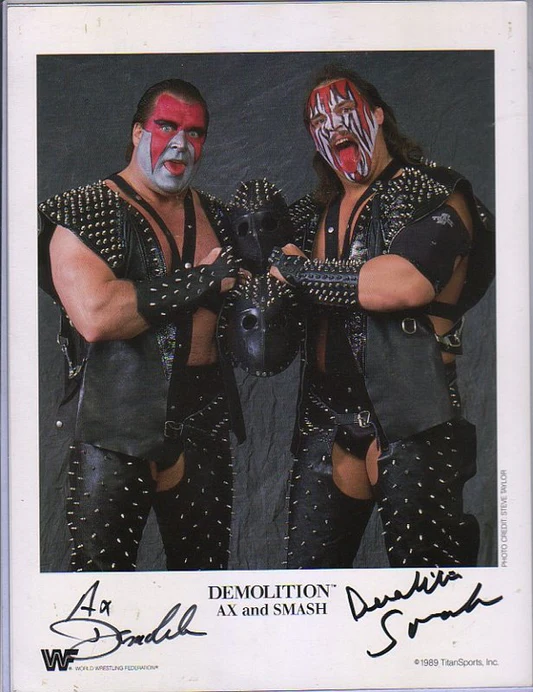 Demolition Ax and Smash wearing their signature studded leather masks and gear during their 1988 entrance