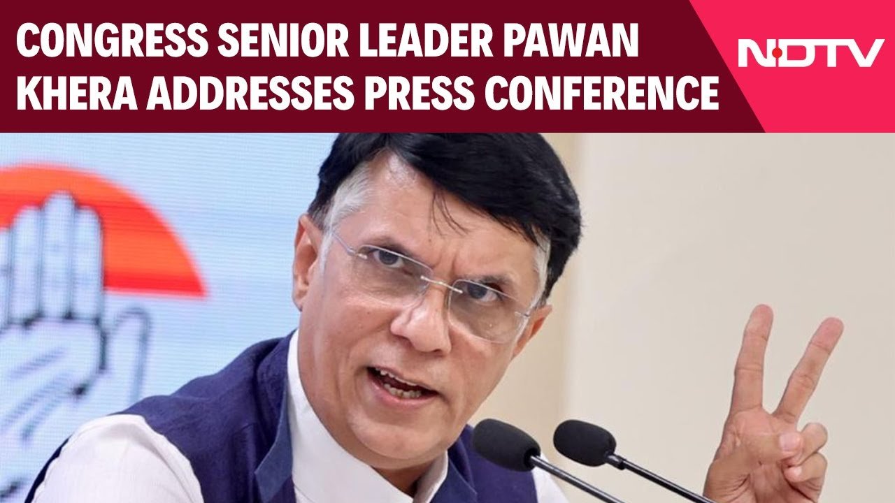 Pawan Khera addressing a press conference for the Indian National Congress