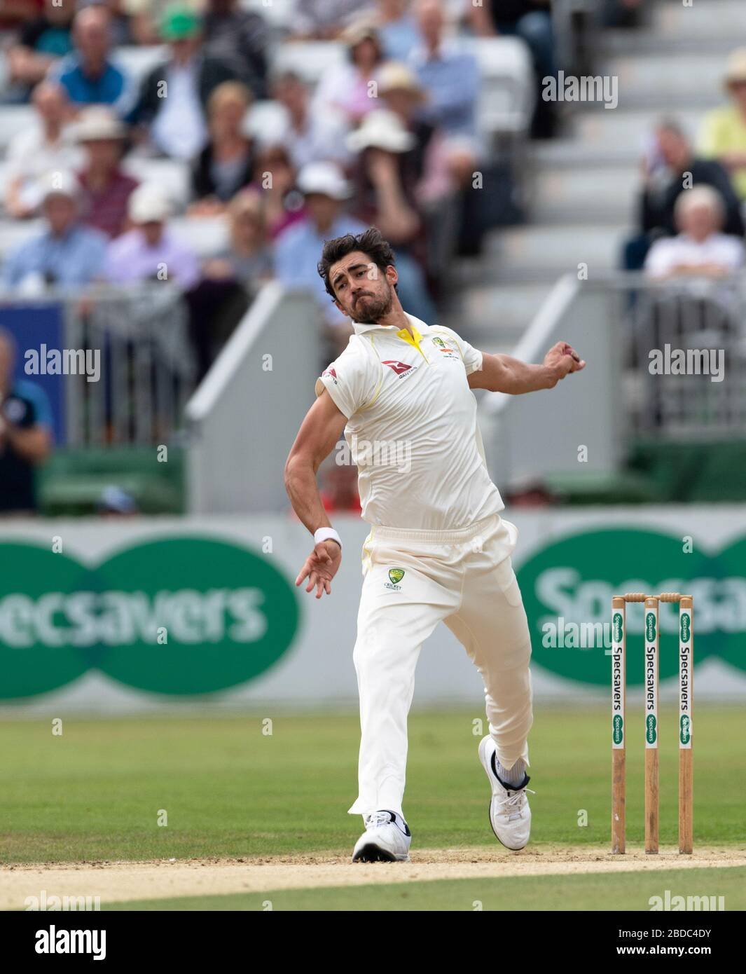 Mitchell Starc delivering a fast ball with his signature high-arm action