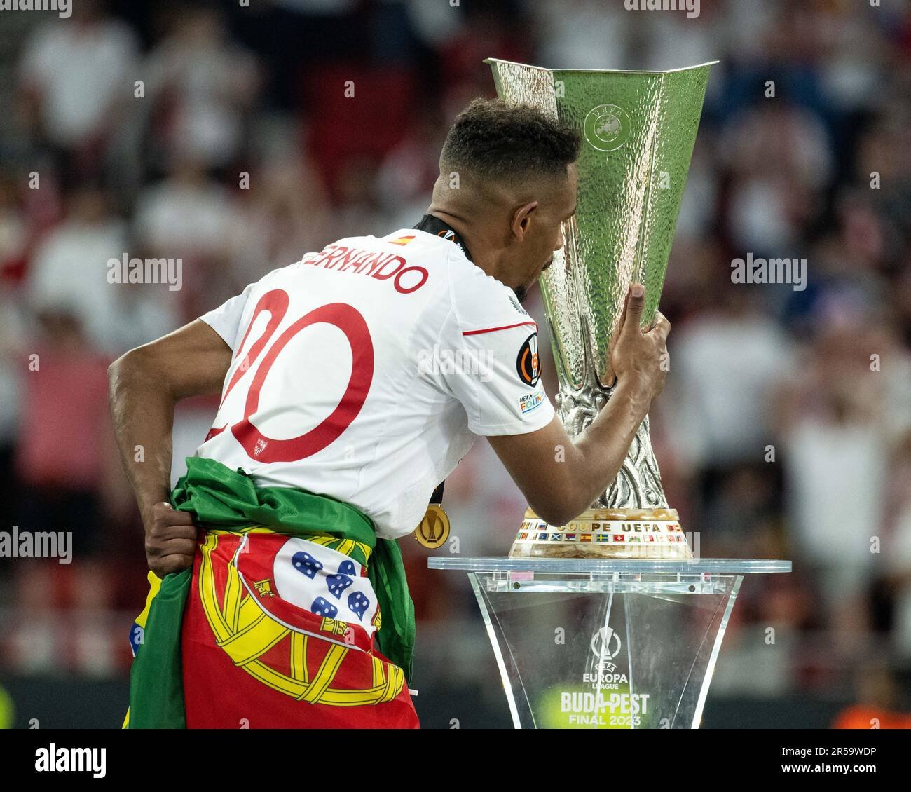 Action shot of a recent Europa League final celebration featuring the iconic silver trophy