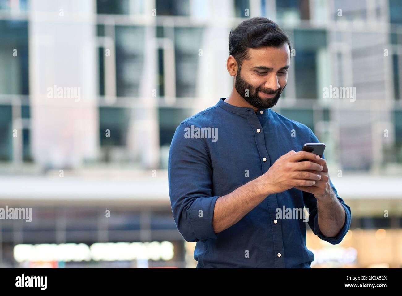 Smartphone user in India accessing digital downloads