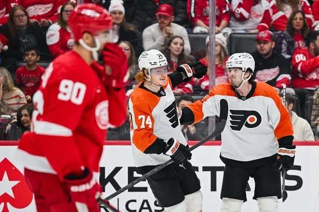 Action shot of Flyers and Red Wings players at Little Caesars Arena