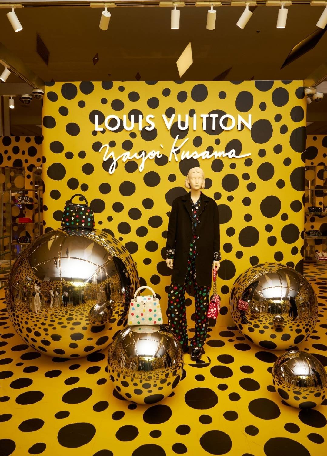 A luxury retail display featuring Yayoi Kusama's signature polka dots