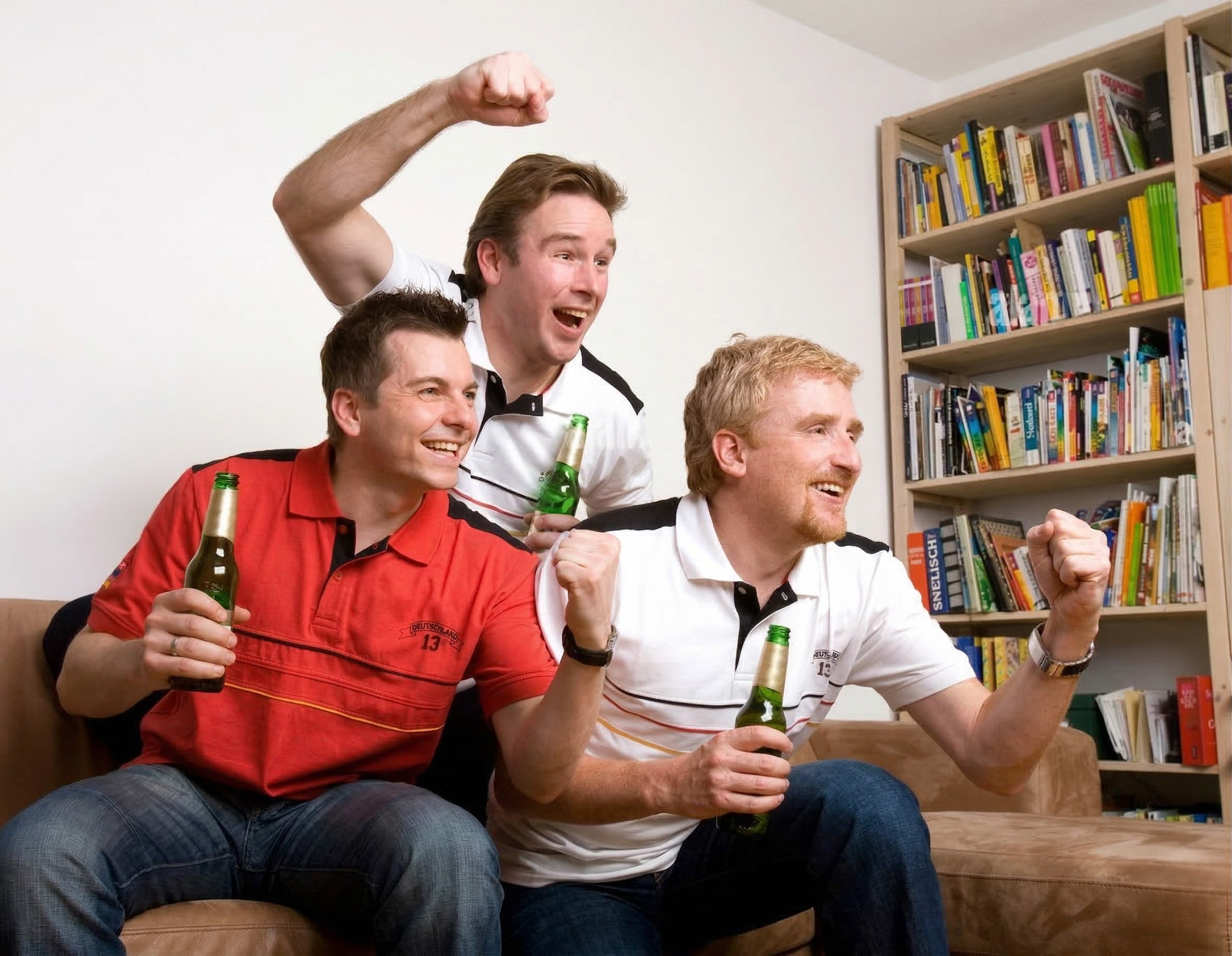 Fans utilizing streaming services to watch live football matches.